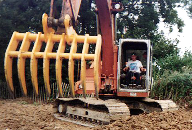 Excavator brush rake