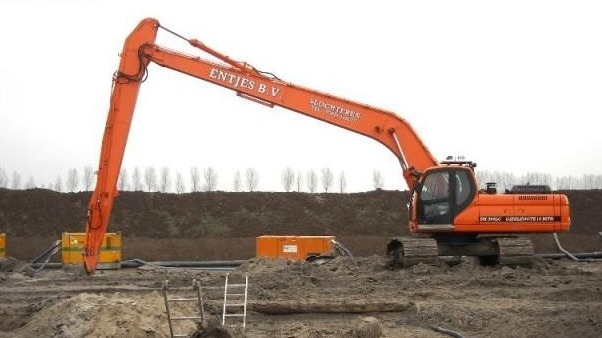 What can the excavator long boom help the development of the city