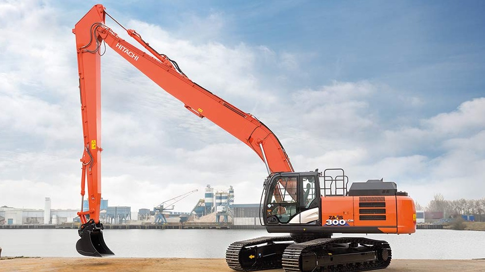 The excavator long boom assists in river management