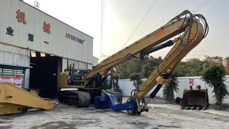 What is the function of the excavator pile driving boom